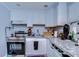 Well-equipped kitchen with modern appliances, light granite countertops, and ample storage at 902 W Columbus Dr, Tampa, FL 33602
