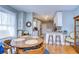 Open kitchen with white cabinets, granite countertops, and adjacent dining area at 902 W Columbus Dr, Tampa, FL 33602