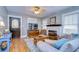 Cozy living room featuring wood floors, a classic fireplace, and plenty of natural light at 902 W Columbus Dr, Tampa, FL 33602
