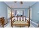 Tranquil bedroom with four poster bed and neutral decor at 902 W Columbus Dr, Tampa, FL 33602