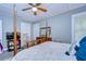 A comfortable bedroom with a ceiling fan and natural lighting at 902 W Columbus Dr, Tampa, FL 33602