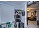 Functional room with shelving, a microwave, and view to a dining area at 902 W Columbus Dr, Tampa, FL 33602