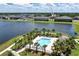 Scenic aerial view of community pool, lake and surrounding neighborhood at 937 Royal Empress Dr, Ruskin, FL 33570