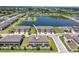 Community aerial view with lake, swimming pool, and multi-Gathering homes at 937 Royal Empress Dr, Ruskin, FL 33570