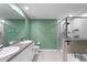 Modern bathroom with double sinks, tiled shower, and a separate soaking tub at 937 Royal Empress Dr, Ruskin, FL 33570