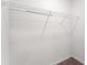 Well-lit closet with wire shelving, offering practical storage solutions at 937 Royal Empress Dr, Ruskin, FL 33570