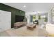 Bright living room with tile flooring, stylish decor, and lots of natural light at 937 Royal Empress Dr, Ruskin, FL 33570