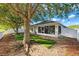 Backyard featuring mature trees and a view of the screened patio at 9479 Southern Charm Cir, Brooksville, FL 34613