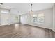 Expansive living room features modern flooring, a neutral color scheme, and plenty of natural light at 9479 Southern Charm Cir, Brooksville, FL 34613