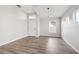 Spacious, freshly painted living area with updated flooring and abundant light from multiple windows at 9479 Southern Charm Cir, Brooksville, FL 34613