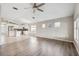 Open living room features hardwood floors and connects to the kitchen at 9479 Southern Charm Cir, Brooksville, FL 34613