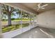 Large screened patio with views of the backyard at 9479 Southern Charm Cir, Brooksville, FL 34613