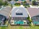 An aerial view of the screened-in pool and spa at 10522 Sky Flower Ct, Land O Lakes, FL 34638