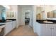 Bright bathroom featuring dual sinks, granite countertops, and separate shower area for convenience at 10522 Sky Flower Ct, Land O Lakes, FL 34638