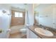 Neutral toned bathroom with single sink, granite countertop and a shower-tub combination at 10522 Sky Flower Ct, Land O Lakes, FL 34638
