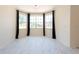 Bright dining area featuring tile floors and bay windows at 10522 Sky Flower Ct, Land O Lakes, FL 34638