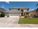 Charming two-story home with manicured lawn and a three car garage at 10522 Sky Flower Ct, Land O Lakes, FL 34638