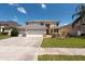 Charming two-story home with manicured lawn and a three car garage at 10522 Sky Flower Ct, Land O Lakes, FL 34638