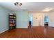 Upstairs hallway with hardwood floors, light blue accent wall, and access to multiple bedrooms, offering ample living space at 10522 Sky Flower Ct, Land O Lakes, FL 34638