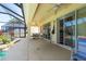 Covered patio with screening around the pool is ideal for relaxing or entertaining at 10522 Sky Flower Ct, Land O Lakes, FL 34638