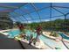 Enjoy this screened pool and lanai featuring water view, creating a private retreat for Gathering and friends at 10522 Sky Flower Ct, Land O Lakes, FL 34638