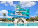The community pool features a waterslide with blue and turquoise flumes at 10652 Crescent Creek Xing, Parrish, FL 34219