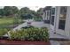 Lush backyard with patio, lake view, and beautiful landscaping for outdoor enjoyment at 11217 Fiddlewood Dr, Riverview, FL 33579