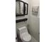 Cozy bathroom with well-maintained toilet, wall art, and modern fixtures at 11217 Fiddlewood Dr, Riverview, FL 33579