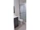 Bathroom featuring a modern vanity and a glass-enclosed shower with modern tile at 11217 Fiddlewood Dr, Riverview, FL 33579