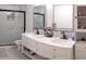 Modern bathroom featuring a glass-enclosed shower and dual vanity at 11217 Fiddlewood Dr, Riverview, FL 33579
