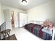 Bright bedroom with a single bed, light walls, and an armoire closet at 11217 Fiddlewood Dr, Riverview, FL 33579