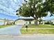 Charming single-story home featuring a well-maintained lawn and a two-car garage at 11217 Fiddlewood Dr, Riverview, FL 33579