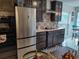 Updated kitchen featuring stainless steel appliances, custom backsplash and cabinets at 11217 Fiddlewood Dr, Riverview, FL 33579