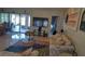 Bright living room with tile floors, large TV, and comfortable seating at 11217 Fiddlewood Dr, Riverview, FL 33579