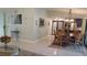 Open-concept living area with dining table and view into the kitchen at 11217 Fiddlewood Dr, Riverview, FL 33579