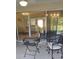Covered patio with comfortable seating and a view of the interior and exterior of the home at 11217 Fiddlewood Dr, Riverview, FL 33579