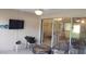 Cozy patio with comfortable seating and outdoor TV, perfect for entertaining at 11217 Fiddlewood Dr, Riverview, FL 33579