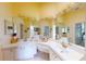 Bathroom featuring double sinks, vanity, white cabinets and a large mirror at 11368 Copley Ct, Spring Hill, FL 34609