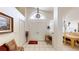 Bright foyer with tile floors, a chandelier, and a view of the dining room at 11368 Copley Ct, Spring Hill, FL 34609