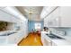 Efficient kitchen with white cabinetry, modern appliances, and wood-look flooring at 11368 Copley Ct, Spring Hill, FL 34609