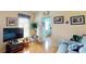 Relaxing living room with wooden floors, a TV, and comfortable furniture at 11368 Copley Ct, Spring Hill, FL 34609