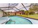 Enclosed pool area with a clear view of the pool, patio, and surrounding landscape at 11368 Copley Ct, Spring Hill, FL 34609