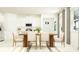 Open concept dining area adjacent to the kitchen, featuring a modern table and natural light at 11809 Sparkling Topaz Cv, Parrish, FL 34219
