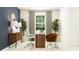 Stylish home office with elegant decor, plants, natural light, and comfortable seating at 11809 Sparkling Topaz Cv, Parrish, FL 34219
