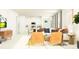 Open-concept living room with sleek furniture, modern décor, and bright, airy atmosphere at 11809 Sparkling Topaz Cv, Parrish, FL 34219