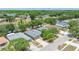 Aerial view of a home showing the roof, driveway, landscaping, and neighborhood at 13643 Tramore Dr, Odessa, FL 33556