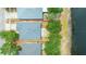 Aerial shot of a home's roof and backyard, bordered by other properties and a body of water at 13643 Tramore Dr, Odessa, FL 33556