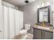 Well-lit bathroom featuring a shower-tub combo with modern fixtures and ample space at 13643 Tramore Dr, Odessa, FL 33556