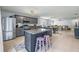 Open concept kitchen with a center island, stainless steel appliances, granite countertops, that flows into the living room at 13643 Tramore Dr, Odessa, FL 33556