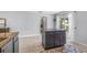 Kitchen island offering granite countertops, cabinetry, and adjacent doors leading to an outdoor patio at 13643 Tramore Dr, Odessa, FL 33556